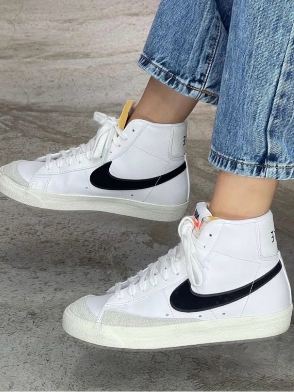 Nike unisex White High-Top Sneakers with Black Swoosh and Yellow Tongue Tab